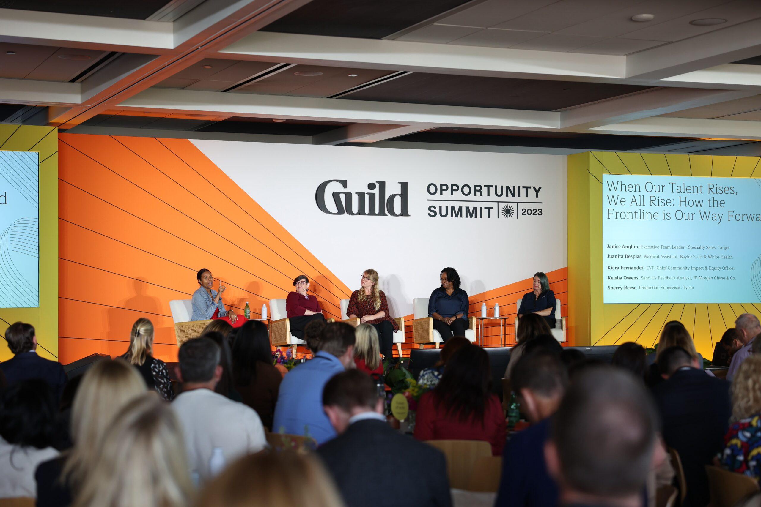 Panelists on the stage at the Guild Opportunity Summit 2023